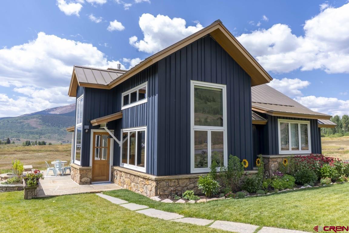 7 Moon Ridge Lane Crested Butte, CO 81224 - Photo 34 of 44 a front view of a house with garden