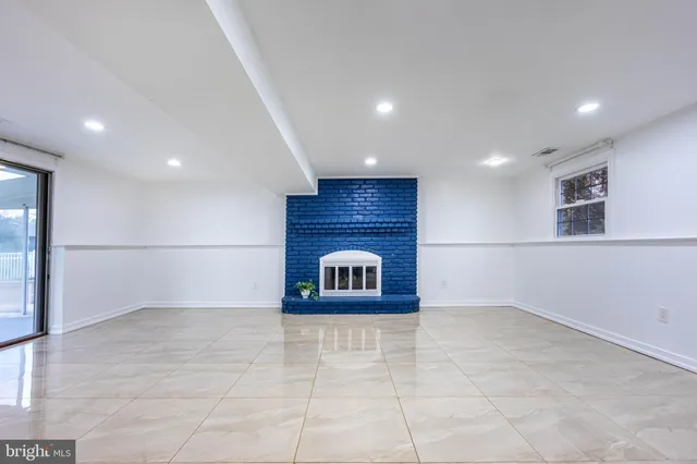 a view of an empty room and a window