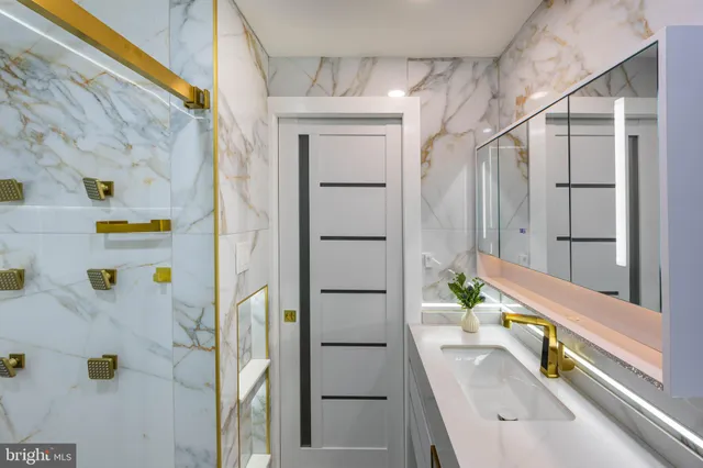 a bathroom with a tub and a shower