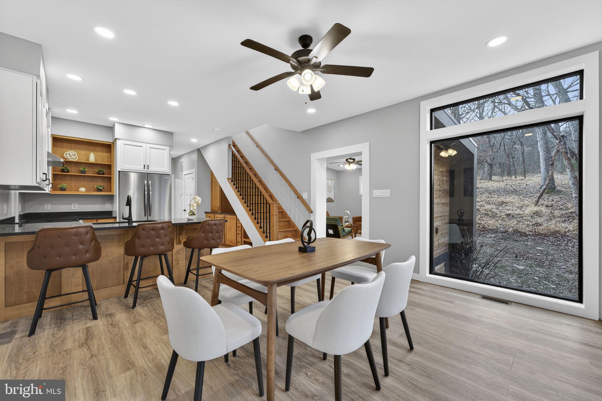 1956 Dove Hollow Road Mathias, WV 26812 - Photo 23 of 113 Dining room with picture windows throughout