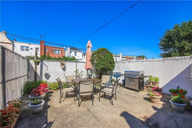 a view of a chairs and table in patio