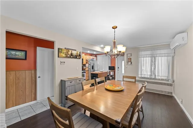 a view of a dining room with furniture and window