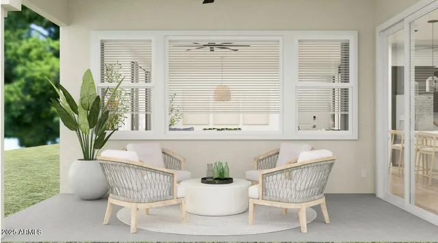 a view of a dining room with furniture and windows