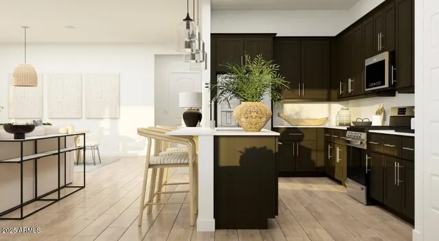 a kitchen with stainless steel appliances kitchen island granite countertop a stove a sink and a microwave