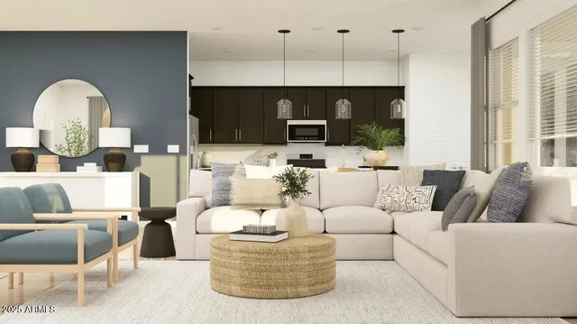 a living room with furniture fireplace and a window