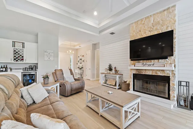 a bedroom with a bed tv and a window