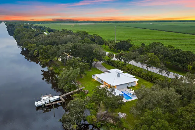 a view of swimming pool with outdoor seating and yard in the back