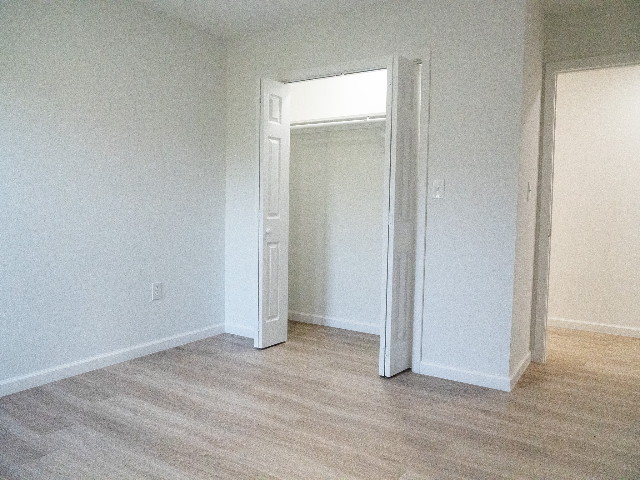 37 Road 5102, Unit L Cleveland, TX 77327 - Photo 14 of 29 an empty room with wooden floor & closet area