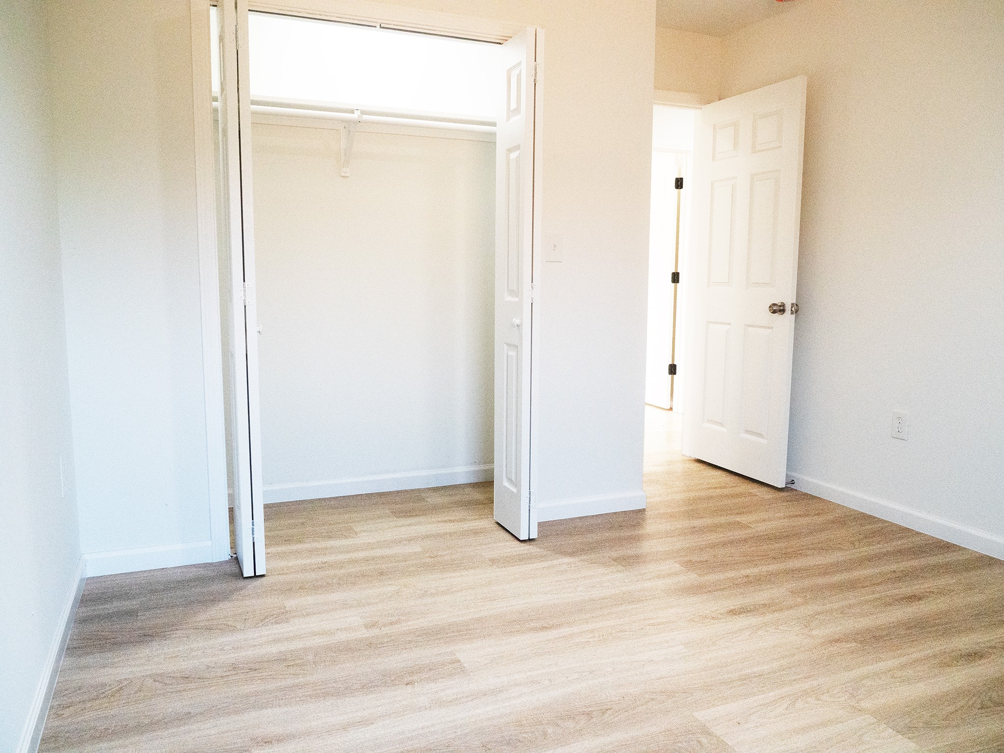 37 Road 5102, Unit L Cleveland, TX 77327 - Photo 15 of 29 a view of a room with wooden floor
