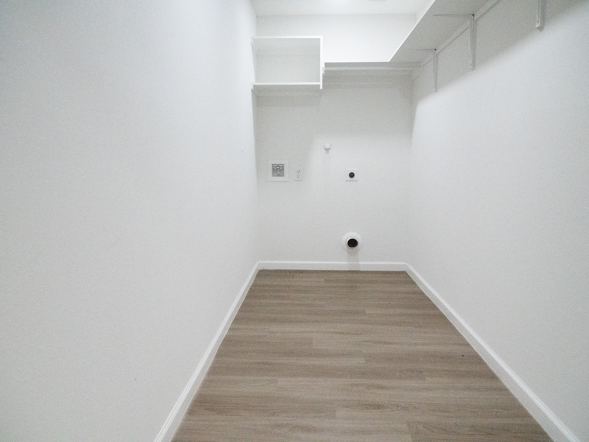 37 Road 5102, Unit L Cleveland, TX 77327 - Photo 16 of 29 a view of a room with wooden floor