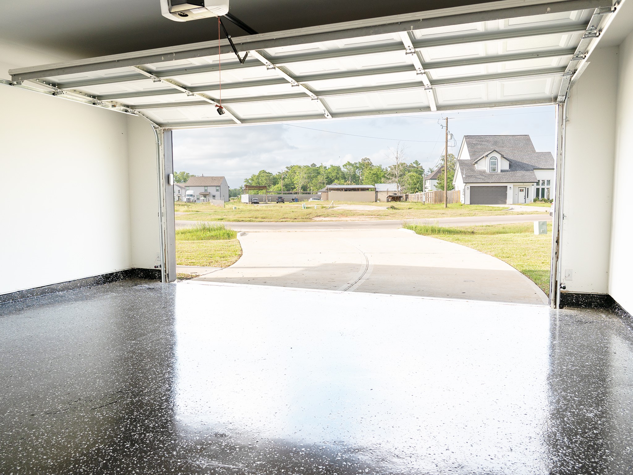 37 Road 5102, Unit L Cleveland, TX 77327 - Photo 18 of 29 a view of a room with wooden floor and a porch