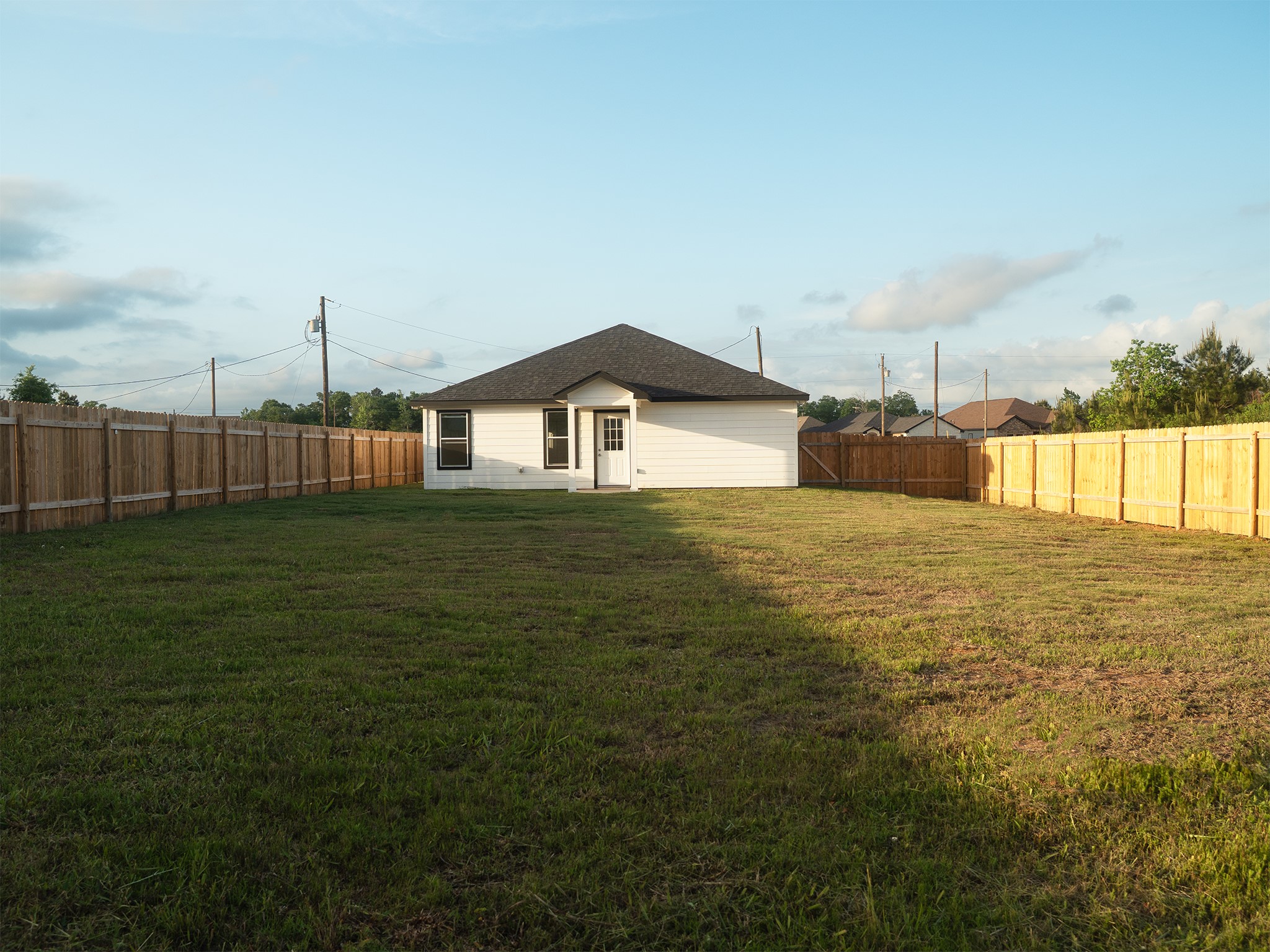 37 Road 5102, Unit L Cleveland, TX 77327 - Photo 21 of 29 a big house with a big yard and large trees