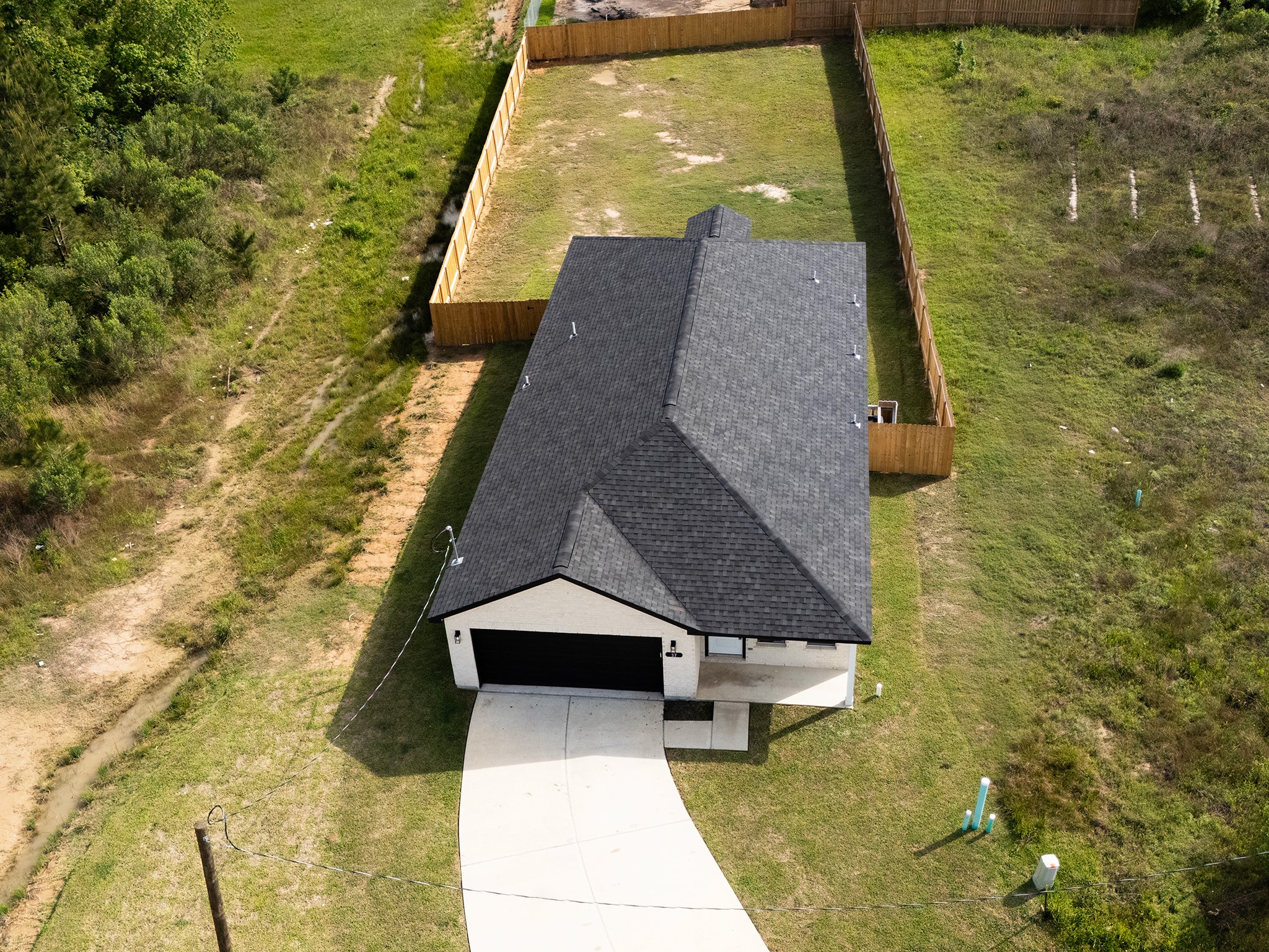37 Road 5102, Unit L Cleveland, TX 77327 - Photo 24 of 29 a aerial view of a house with swimming pool