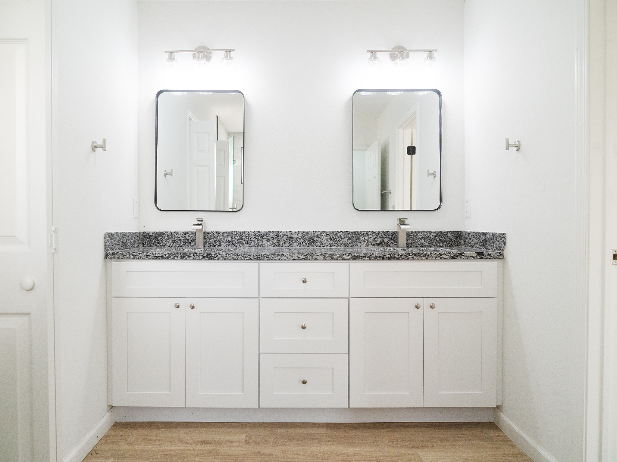 37 Road 5102, Unit L Cleveland, TX 77327 - Photo 7 of 29 a bathroom with double vanity sinks and a mirror