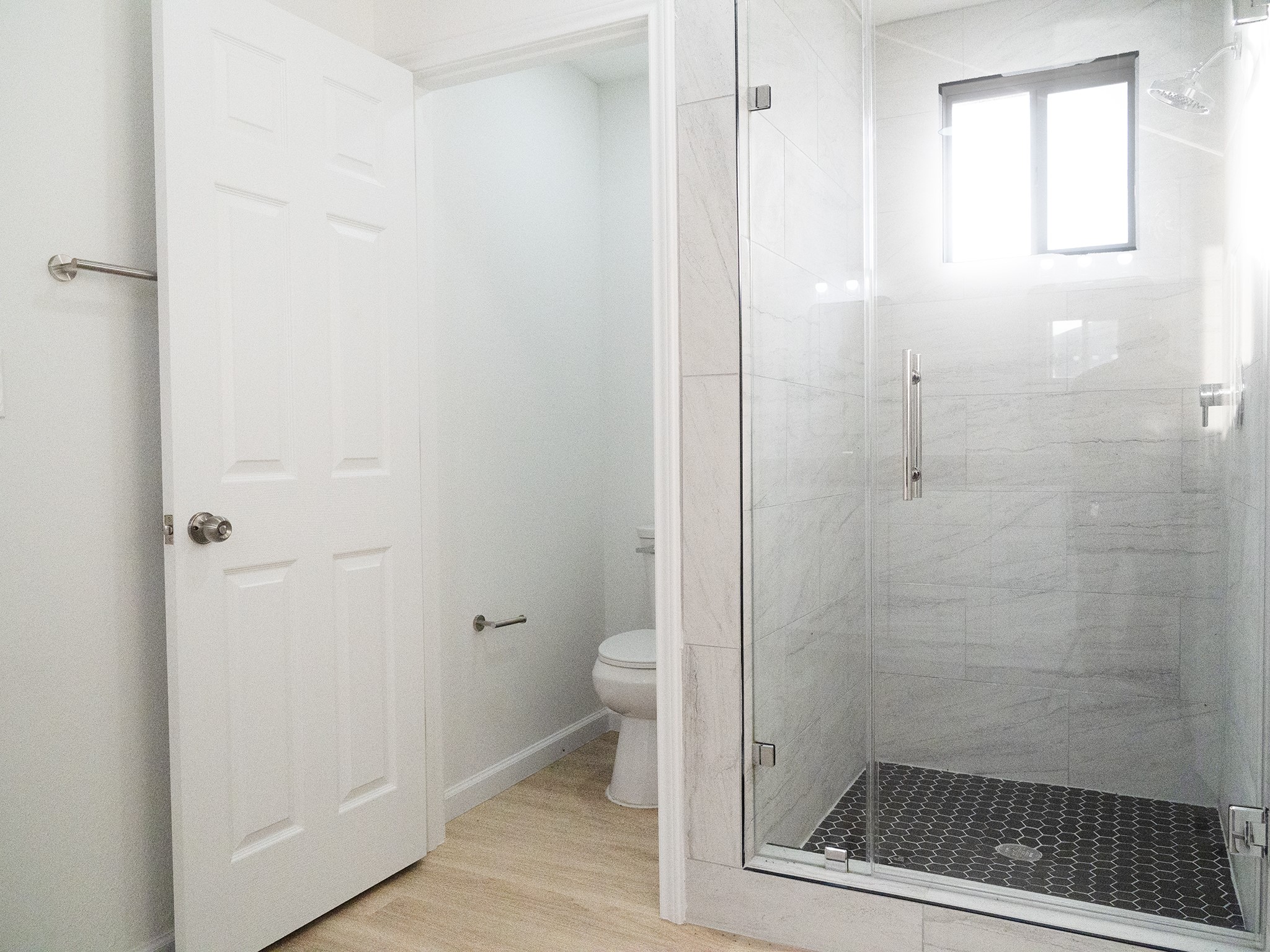 37 Road 5102, Unit L Cleveland, TX 77327 - Photo 8 of 29 a bathroom with a glass door shower