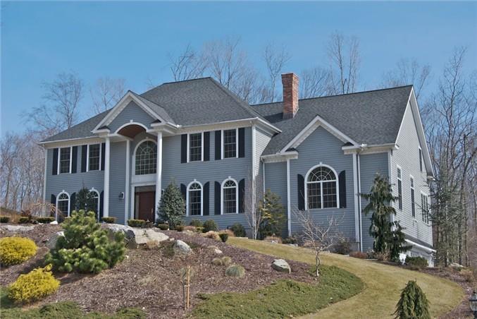 40 Riding Ridge Road Monroe, CT 06468 - Photo 1 of 1 a front view of a house with a yard