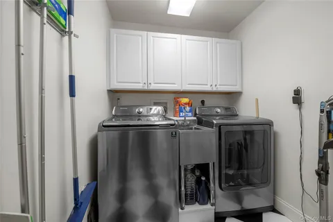 a kitchen with a refrigerator and cabinets