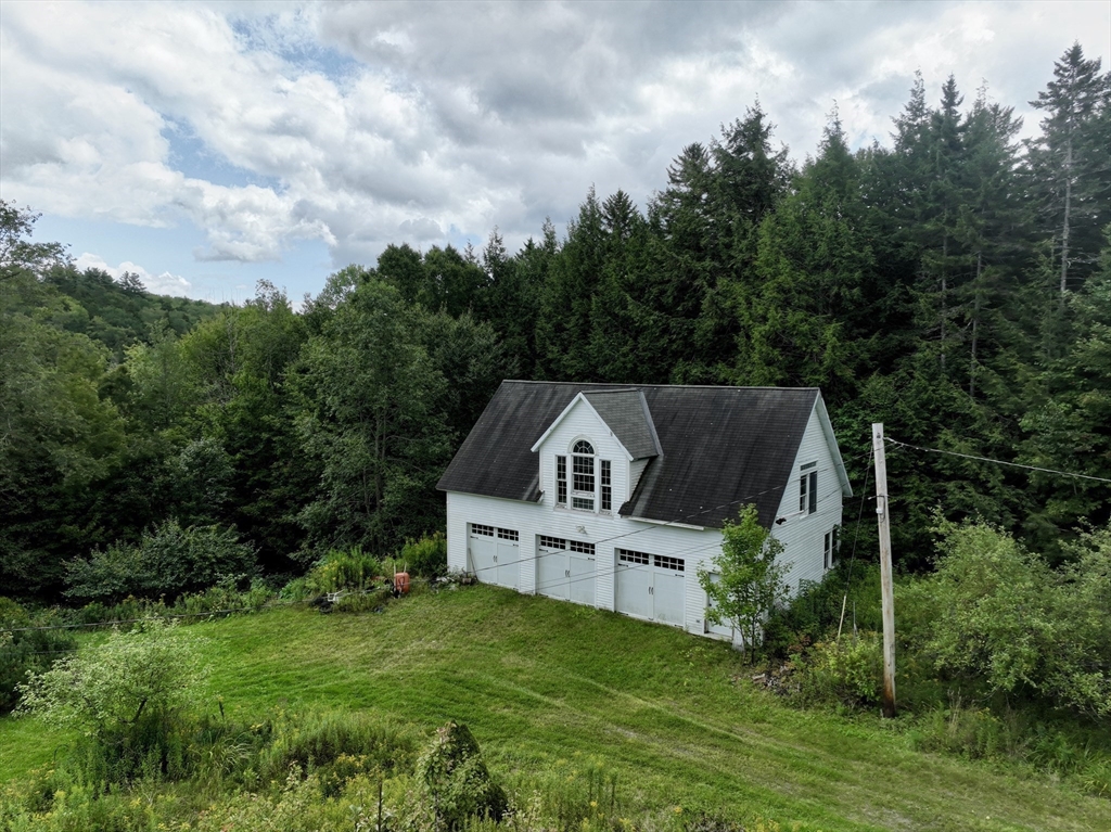 302 Number 9 Road Heath, MA 01367 - Photo 25 of 31 an aerial view of house with yard and trees in the background