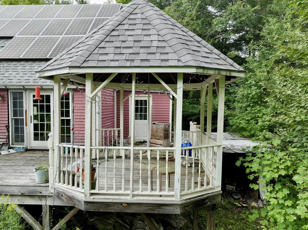 302 Number 9 Road Heath, MA 01367 - Photo 7 of 31 a front view of a house with porch and garden