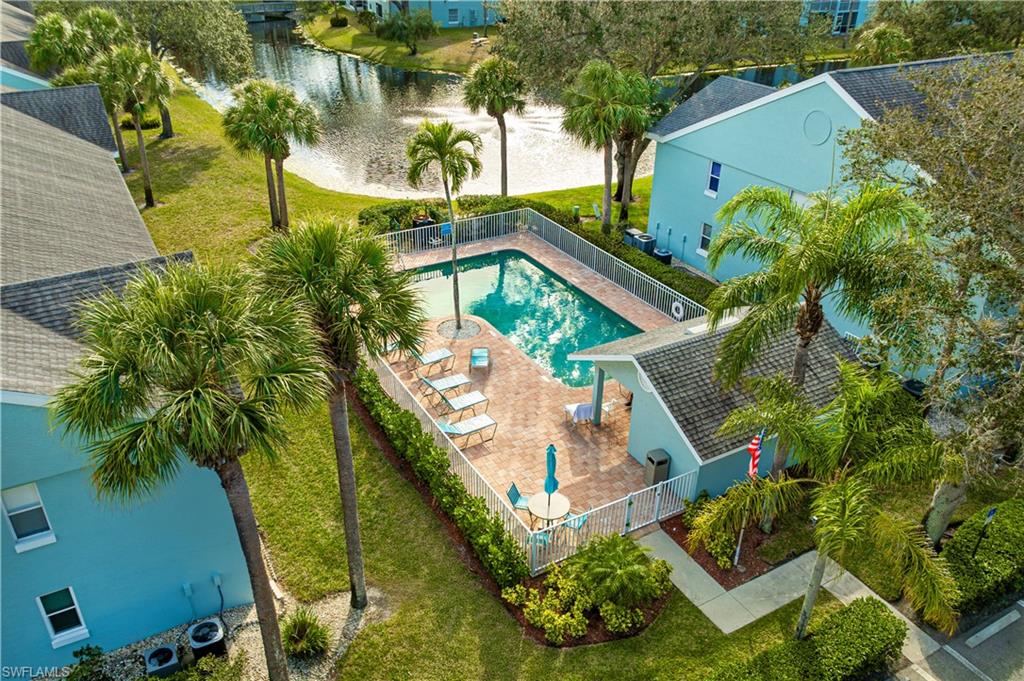 137 Wading Bird Circle, Unit F101 Naples, FL 34110 - Photo 14 of 16 an aerial view of house with swimming pool