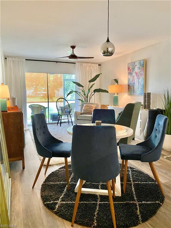 137 Wading Bird Circle, Unit F101 Naples, FL 34110 - Photo 3 of 16 a view of a dining room with furniture window and outside view