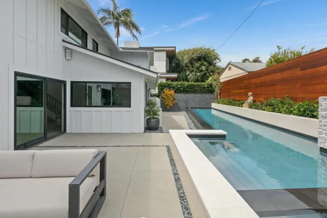 a view of a patio with chairs and a table