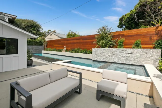 a bedroom with a large bed and a large window