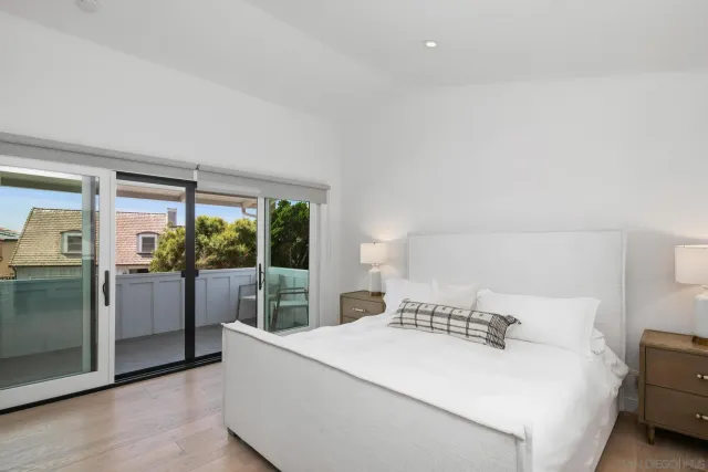 a bathroom with a tub a sink and mirror