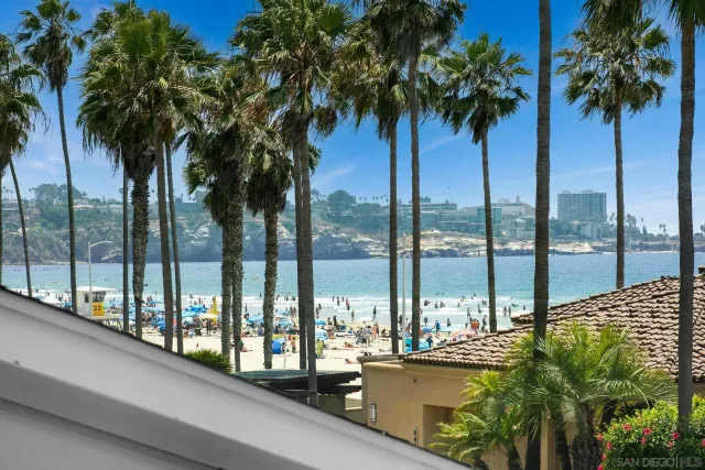 a view of balcony with tall trees