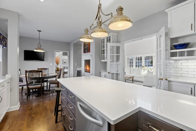 a kitchen with a stove a sink and a refrigerator