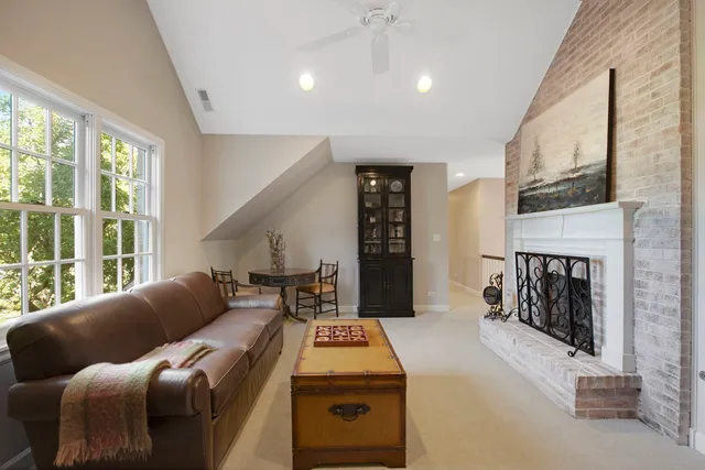 a bedroom with bed and a chair