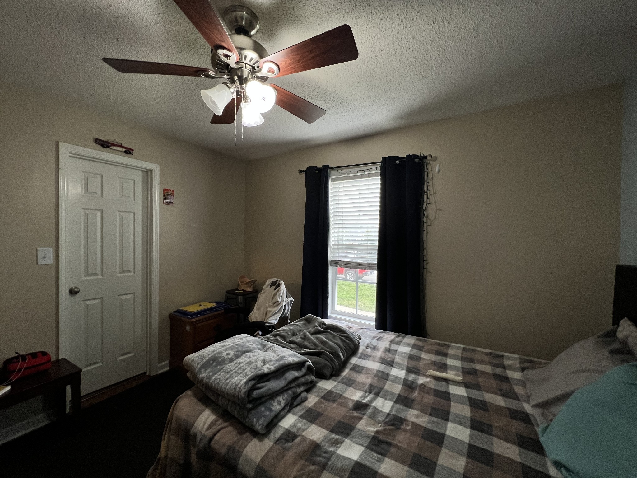 3366 Brownsville Road Clarksville, TN 37043 - Photo 12 of 23 a bedroom with a bed and a chandelier