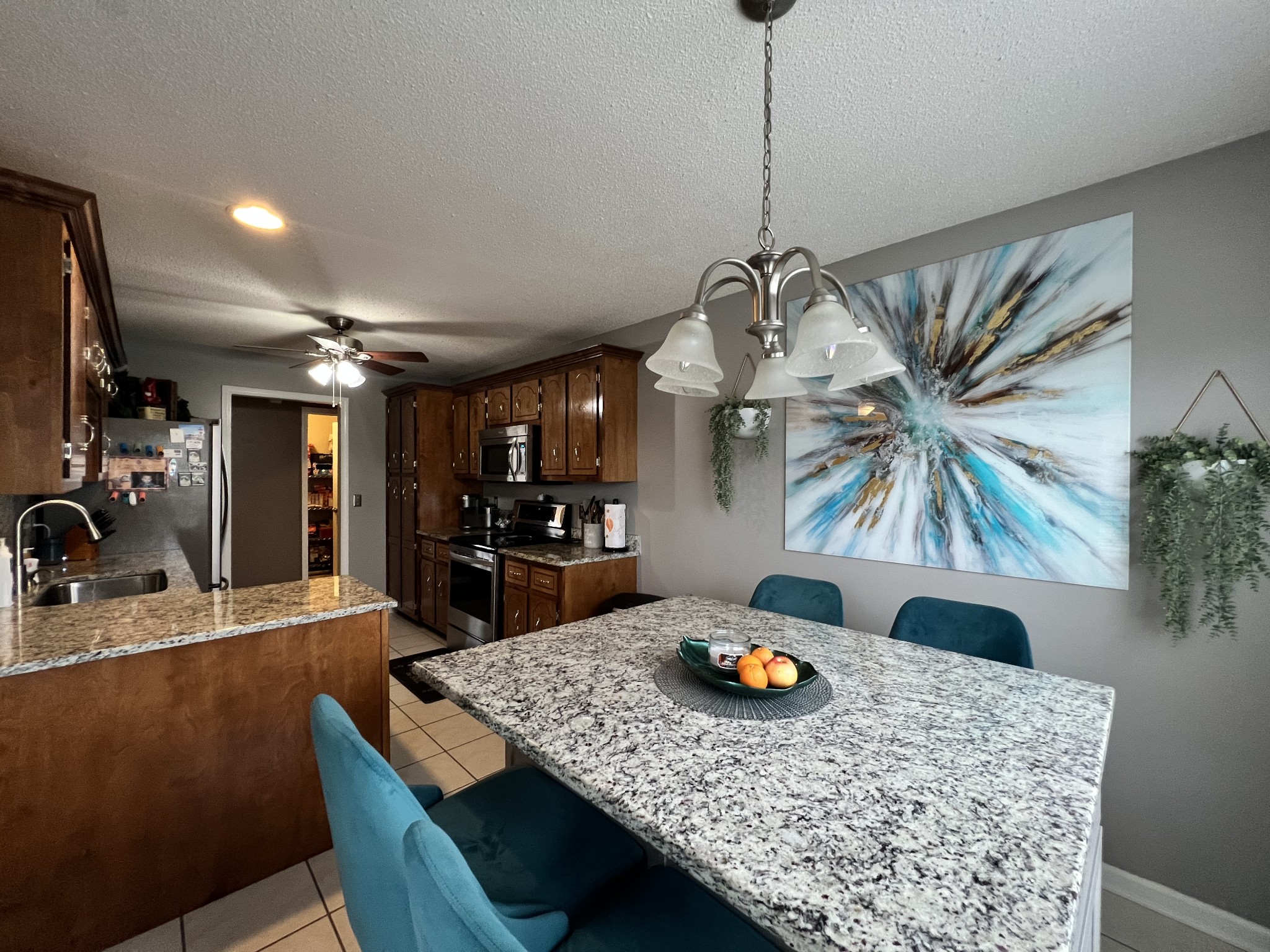 3366 Brownsville Road Clarksville, TN 37043 - Photo 16 of 23 a kitchen with a table chairs and white cabinets