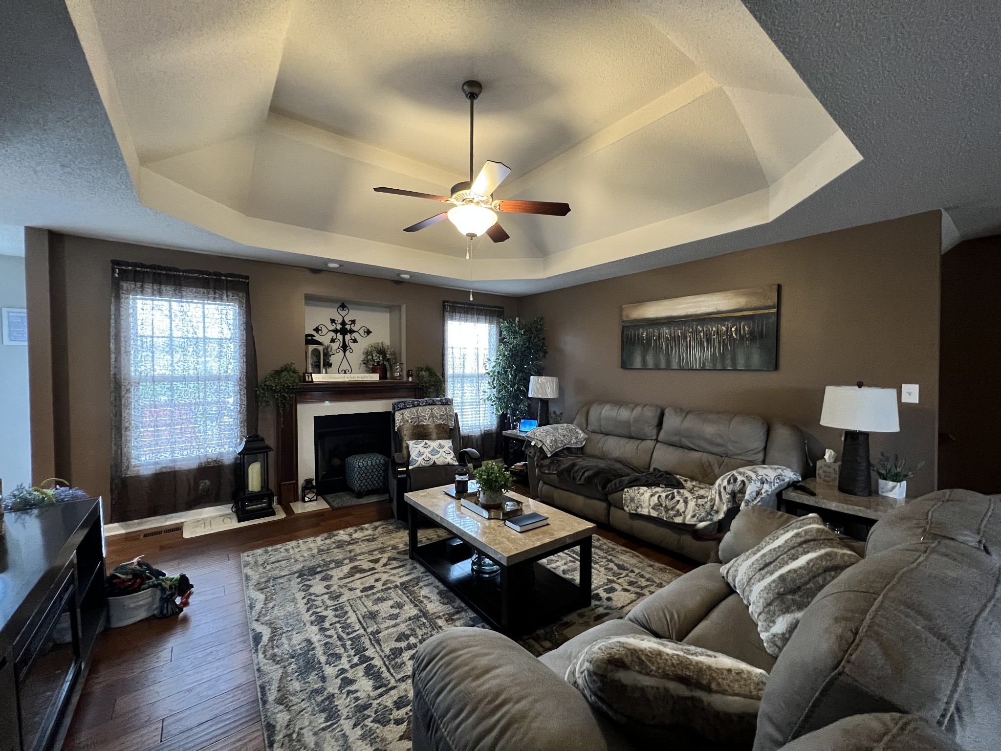 3366 Brownsville Road Clarksville, TN 37043 - Photo 5 of 23 a living room with furniture a fireplace and a chandelier