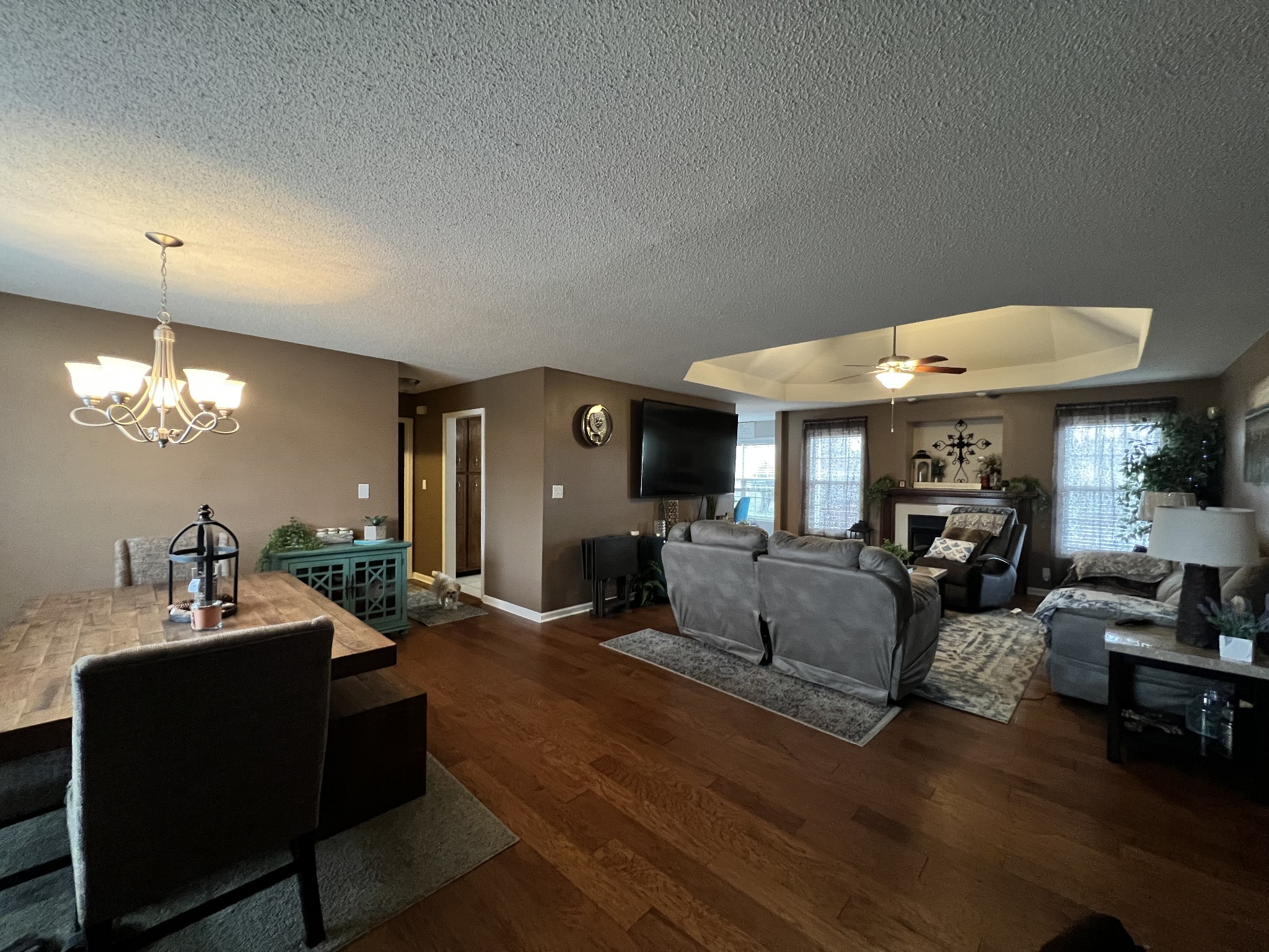 3366 Brownsville Road Clarksville, TN 37043 - Photo 6 of 23 a living room with furniture a fireplace and a chandelier