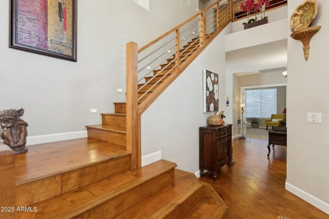 a view of entryway and hall with wooden floor