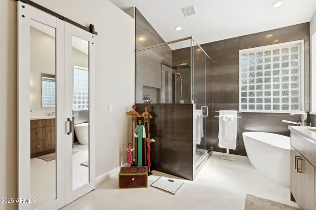 a bathroom with a sink double vanity and a mirror
