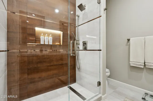 a view of a patio with a dining table and chairs with potted plants