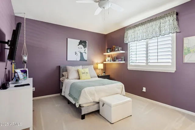 a view of a house with backyard and trees