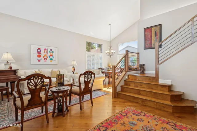 a view of a livingroom with furniture wooden floor and a rug