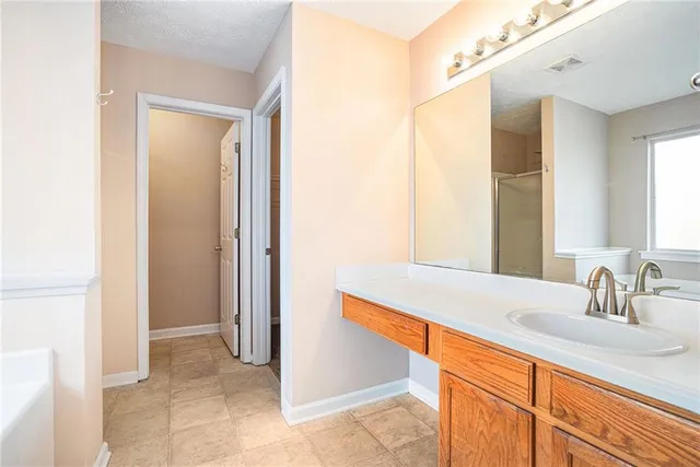 a bathroom with a bathtub and a shower
