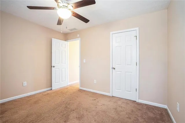 a swimming pool with wooden fence
