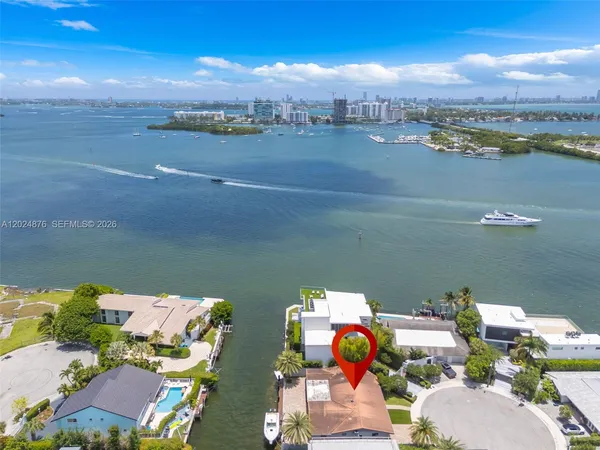 an aerial view of a house with a ocean view
