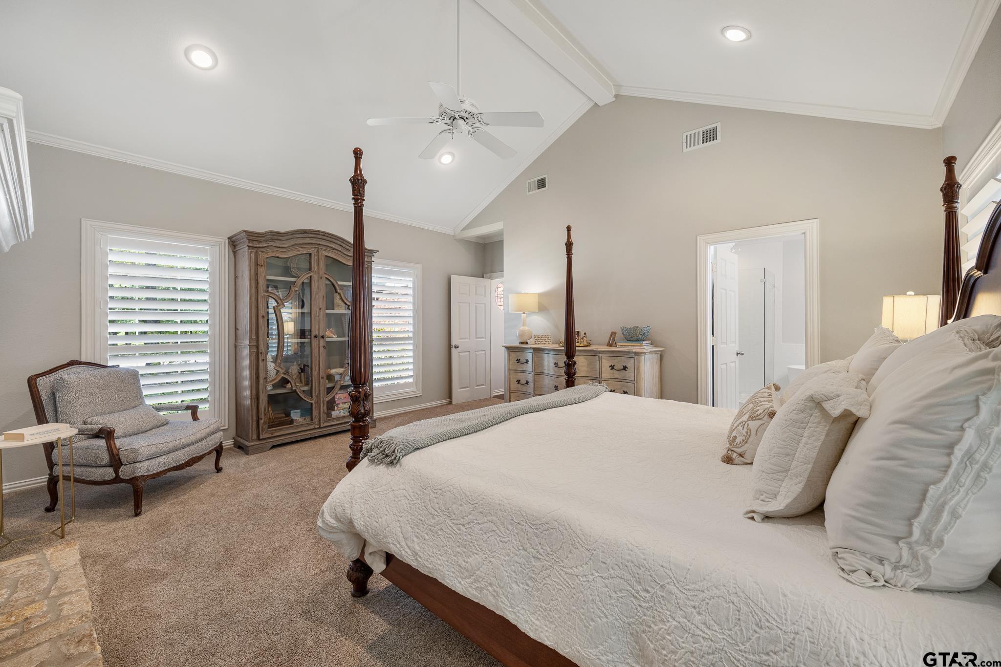 18076 Deer Trail Flint, TX 75762 - Photo 15 of 46 a spacious bedroom with a bed a couch and large window