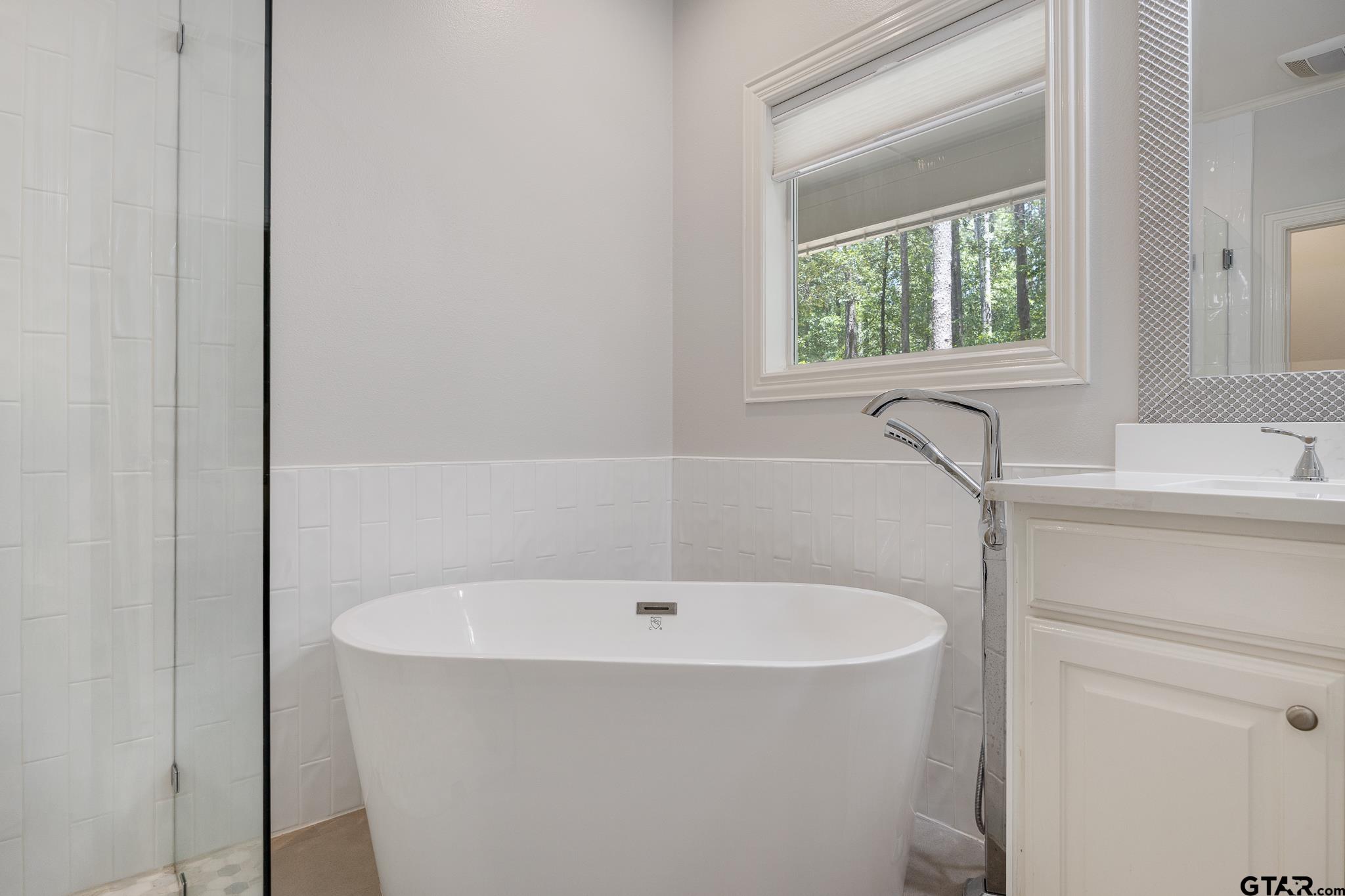 18076 Deer Trail Flint, TX 75762 - Photo 18 of 46 a white bath tub sitting next to a window