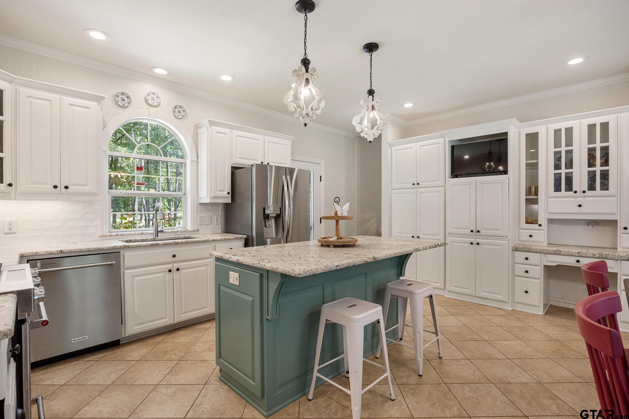 18076 Deer Trail Flint, TX 75762 - Photo 21 of 46 a kitchen with stainless steel appliances granite countertop a sink a stove a refrigerator and cabinets