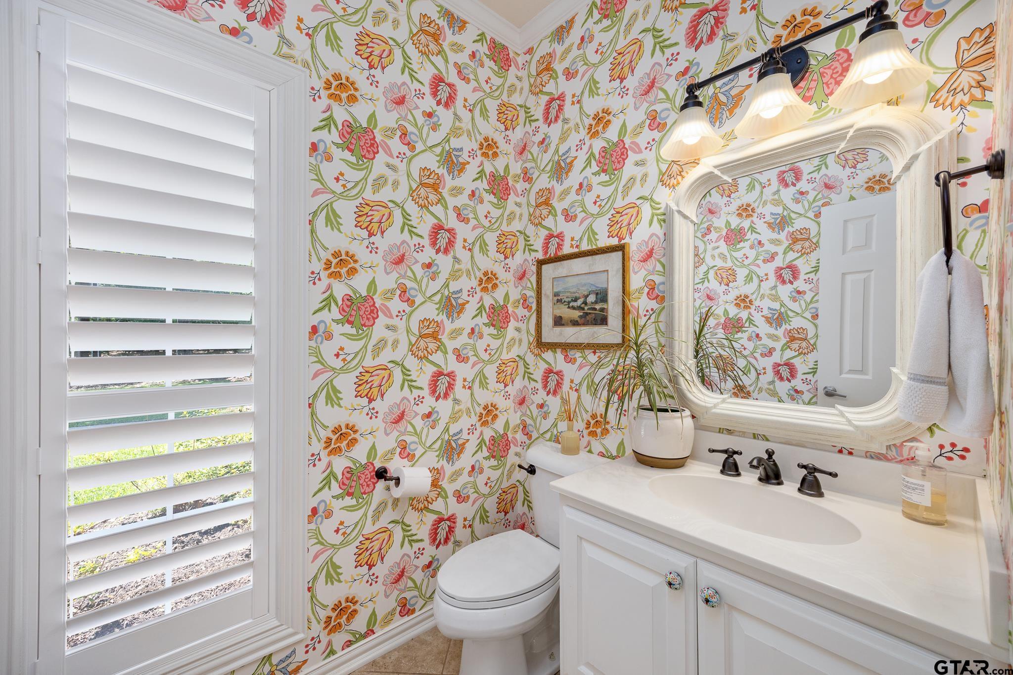 18076 Deer Trail Flint, TX 75762 - Photo 25 of 46 a bathroom with a sink toilet and shower curtain