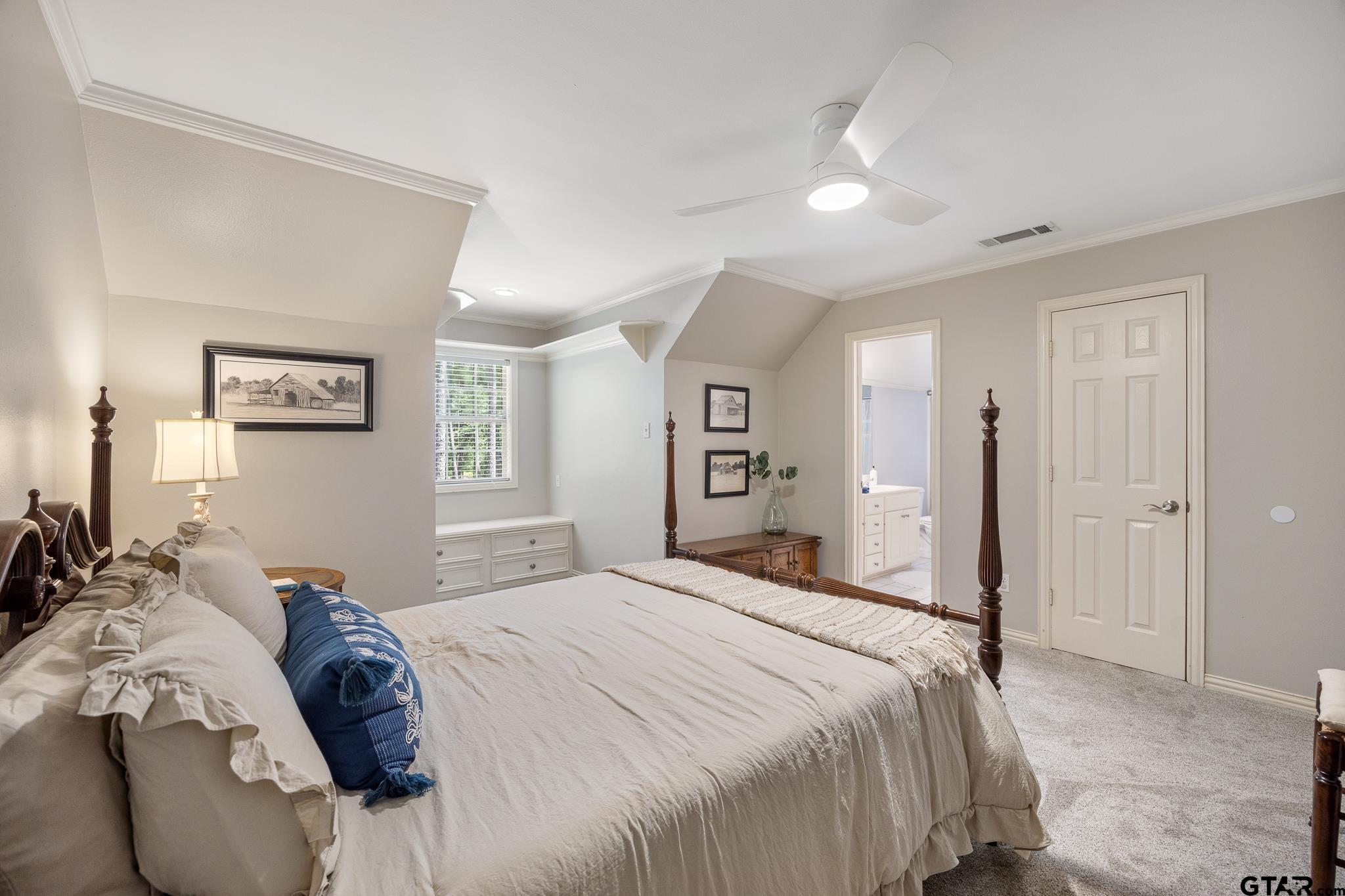 18076 Deer Trail Flint, TX 75762 - Photo 28 of 46 a bedroom with a bed and a large mirror