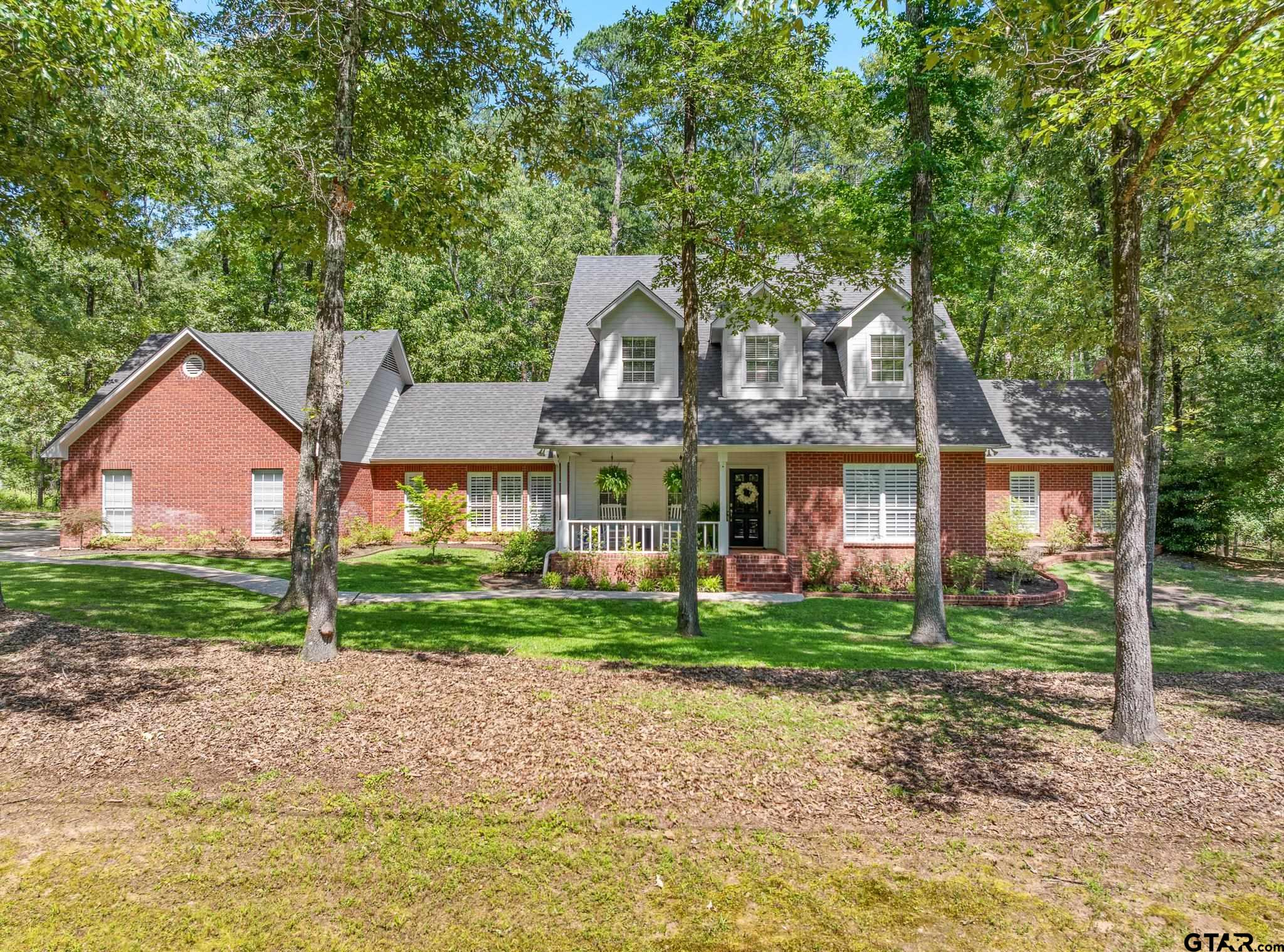 18076 Deer Trail Flint, TX 75762 - Photo 3 of 46 a front view of a house with a yard