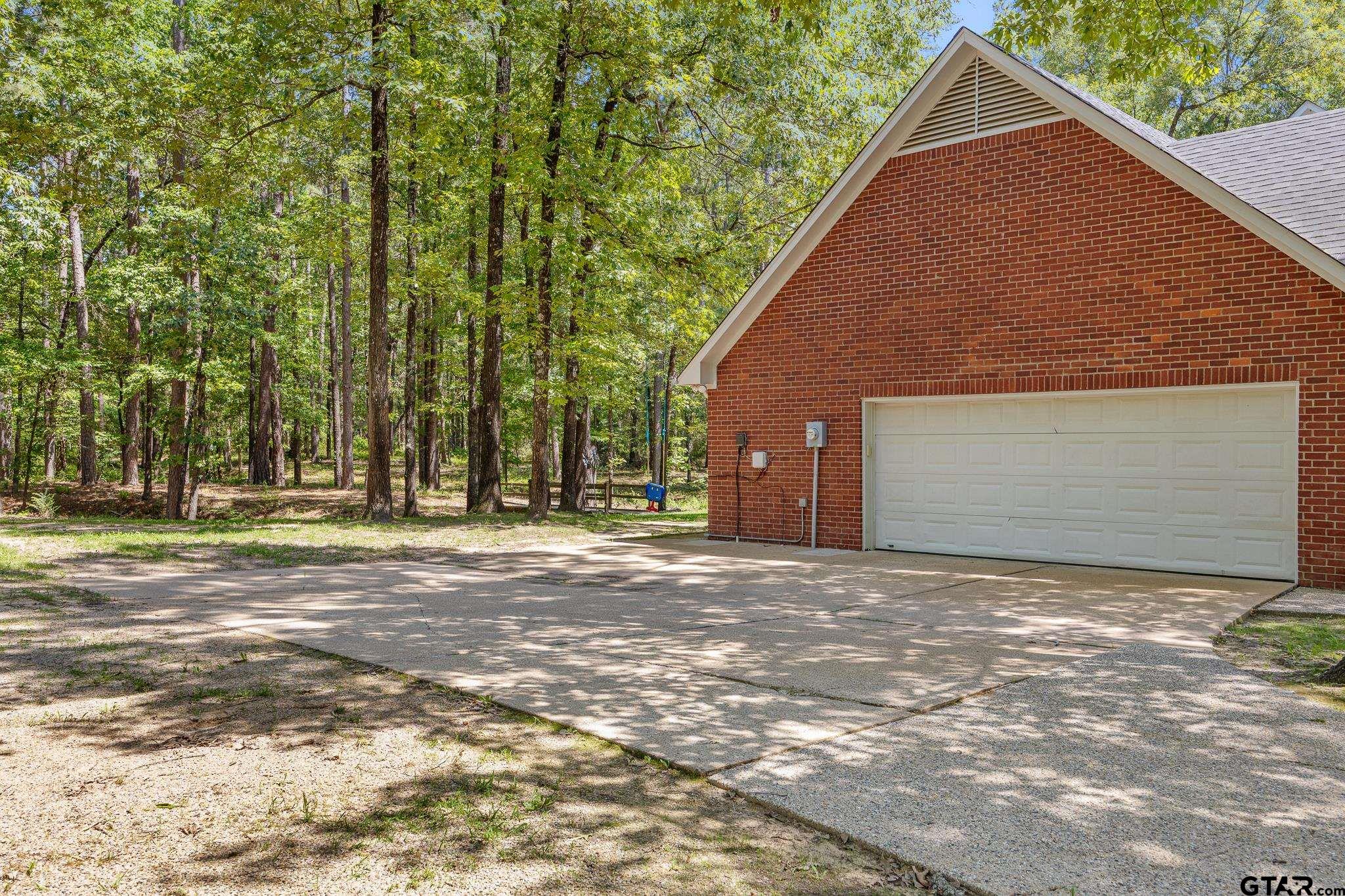18076 Deer Trail Flint, TX 75762 - Photo 34 of 46 a view of a house with backyard and trees